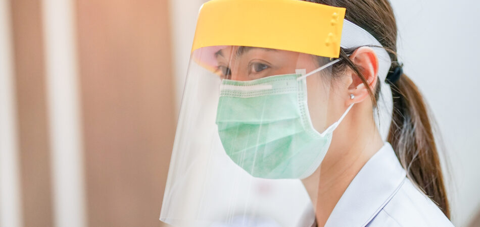 Healthcare worker wearing a face shield